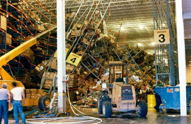 Domino effect rack collapse in warehouse